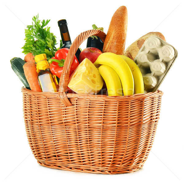 Wicker basket with variety of grocery products isolated on white Stock photo © monticelllo