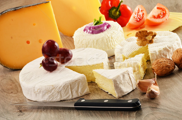 Composition with different sorts of cheese on wooden table Stock photo © monticelllo