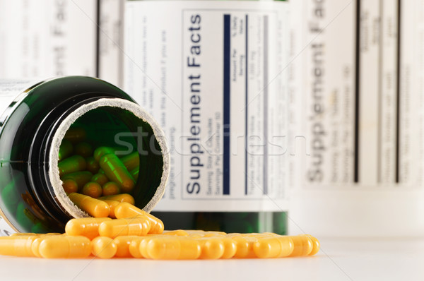 Composition with dietary supplement capsules. Drug pills Stock photo © monticelllo