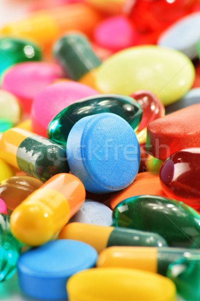 Stock photo: Composition with dietary supplement capsules and drug pills