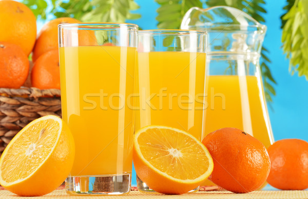 Composition with two glasses of orange juice and fruits Stock photo © monticelllo