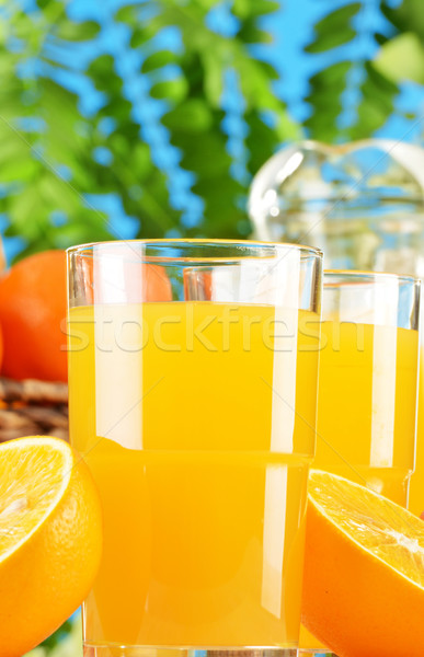 Composition with two glasses of orange juice and fruits Stock photo © monticelllo