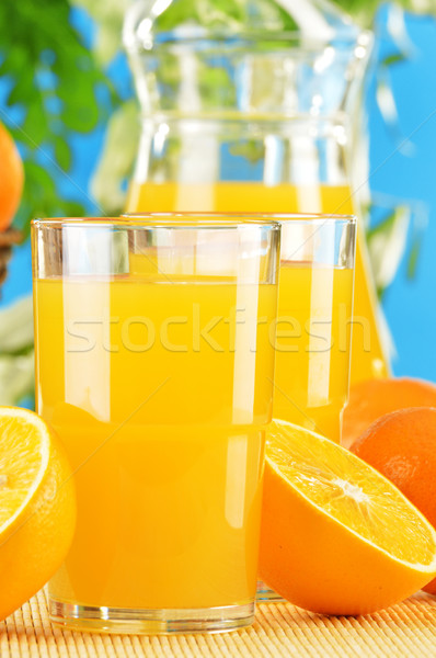 Composition with two glasses of orange juice and fruits Stock photo © monticelllo