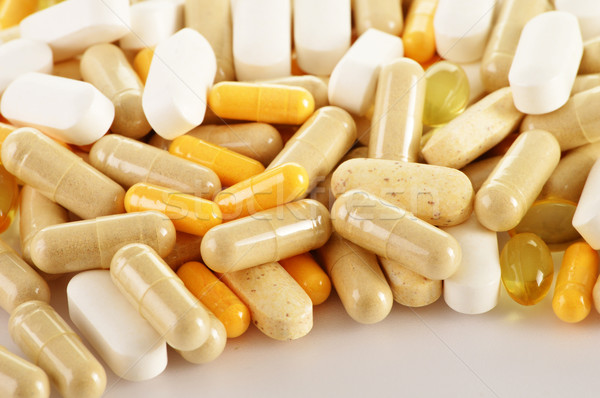 Stock photo: Composition with dietary supplement capsules. Drug pills