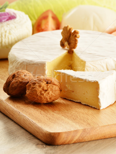 Composition with different sorts of cheese on wooden table Stock photo © monticelllo