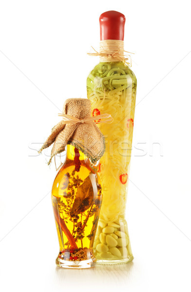 Bottle of traditionaly made extra virgin olive oil with herbs Stock photo © monticelllo