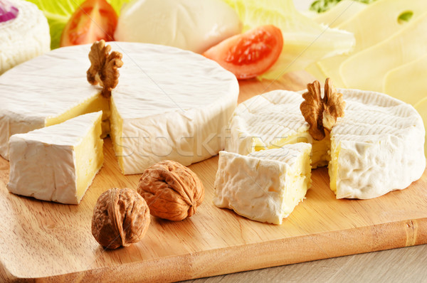 Composition with different sorts of cheese on wooden table Stock photo © monticelllo