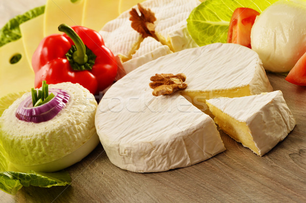 Composition with different sorts of cheese on wooden table Stock photo © monticelllo