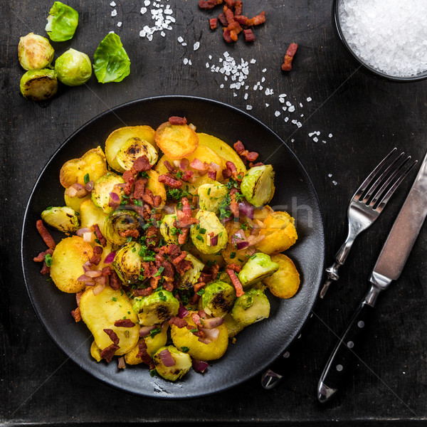 Fried potatoes with Brussels sprouts and bacon Stock photo © Moradoheath