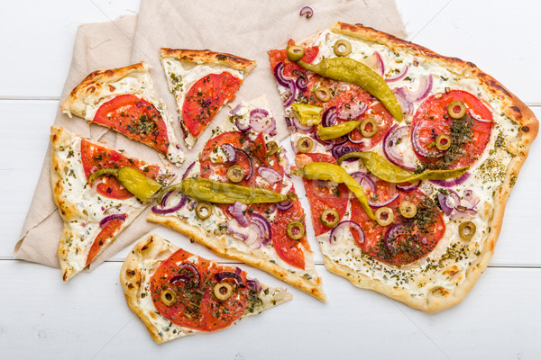 Spicy tarte flambee with pepperoni and olives Stock photo © Moradoheath