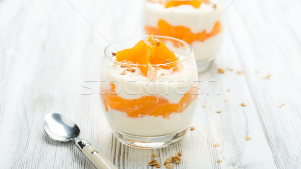 Yogurt naranjas granola frutas vidrio Foto stock © Moradoheath