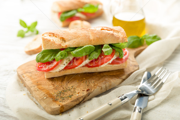 Paradicsom mozzarella francia kenyér friss bazsalikom tavasz Stock fotó © Moradoheath