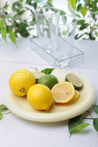 Stock photo: Citrus squeezer and fresh lemons being used to make fresh lemonade