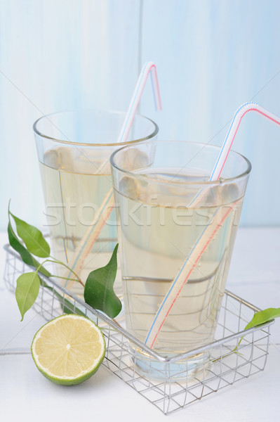Lemonade with lemons and fresh wet leaves Stock photo © Moravska