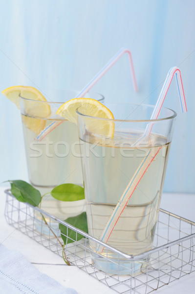 Glass of fresh cold lemonade with lemon slices Stock photo © Moravska