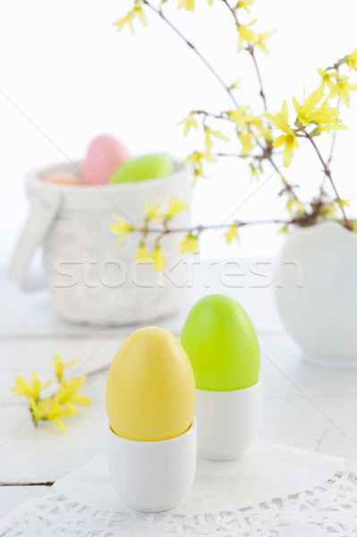 Easter composition with eggs and flowering branches on wooden table Stock photo © Moravska