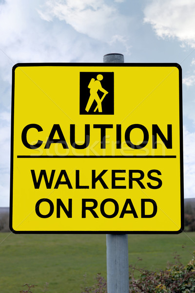 caution walkers on road sign with clipping path Stock photo © morrbyte