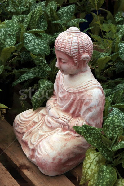Buddha scultura verde impianti sorriso natura Foto d'archivio © morrbyte