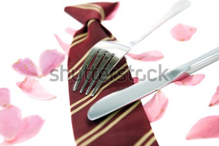 Stock photo: gold and silver forks surrounding heart shape with rose petals