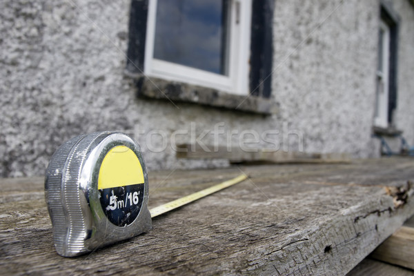 builders diy tape measure on scaffolding at building site Stock photo © morrbyte
