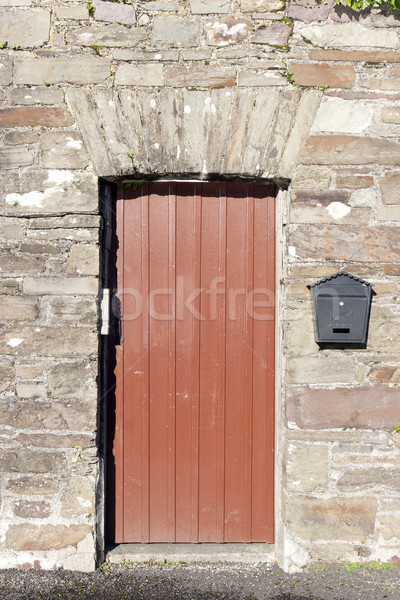 brown wooden doorway and a post box Stock photo © morrbyte