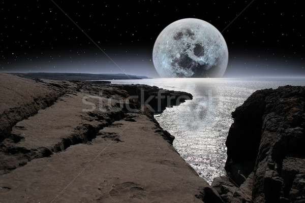 shimmering moon and boulders in rocky burren landscape Stock photo © morrbyte
