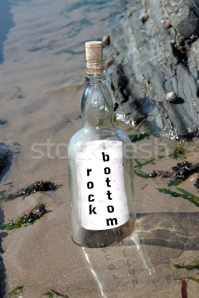 Rock fondo bottiglia messaggio piedi spiaggia Foto d'archivio © morrbyte