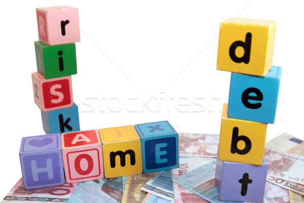 Stock photo: home debt risk in toy play block letters