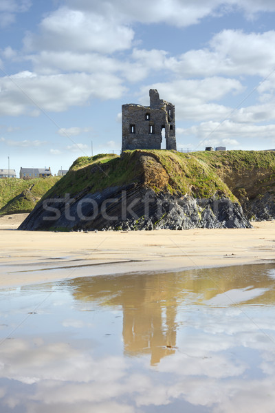 castle and beach with beautiful reflection of the clouds Stock photo © morrbyte