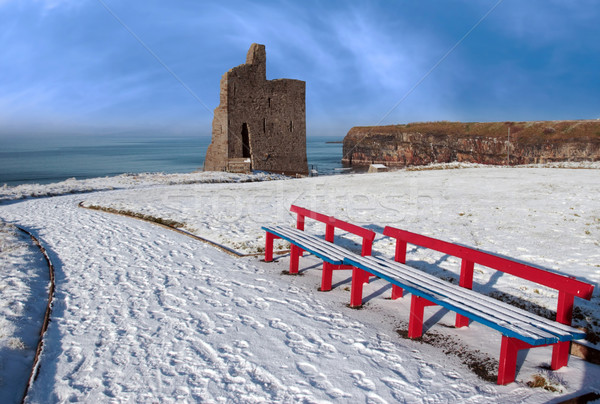 Stock photo: winter view of ballybunion castle and red benches