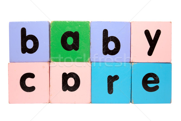 Stock photo: baby care in toy play block letters with clipping path on white