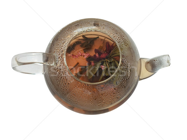 Green tea with flowers in open glass teapot. Top view Stock photo © motttive