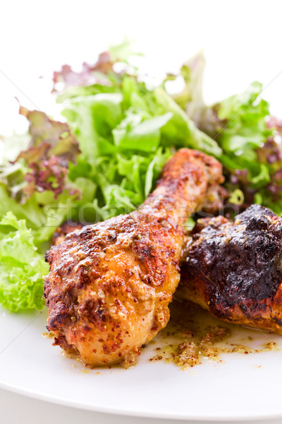 Baharatlı tavuk bacaklar gıda turuncu Stok fotoğraf © mpessaris