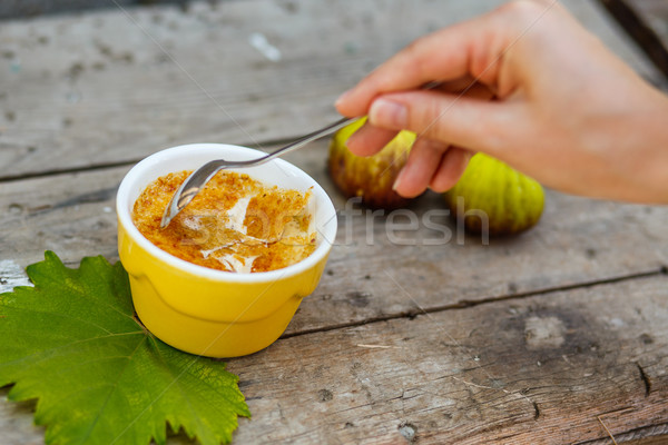 French dessert creme brulee in porcelain bowl on wooden boards Stock photo © mrakor