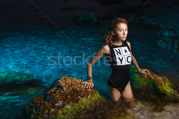 Young teen girl in sea fashion shoot at sunset beach Stock photo © mrakor