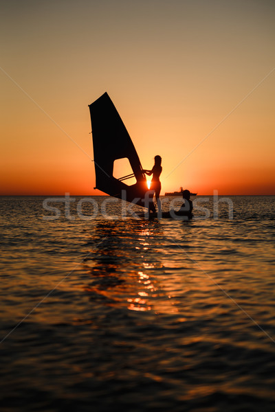 windsurfer learning silhouette against sun Stock photo © mrakor