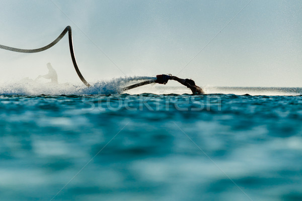 Zdjęcia stock: Sylwetka · latać · pokładzie · plaży · człowiek · sportu