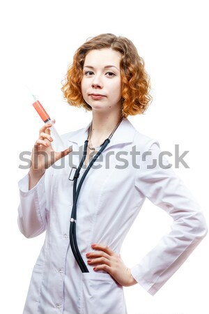 Cute Rotschopf Arzt Laborkittel Spritze isoliert Stock foto © mrakor
