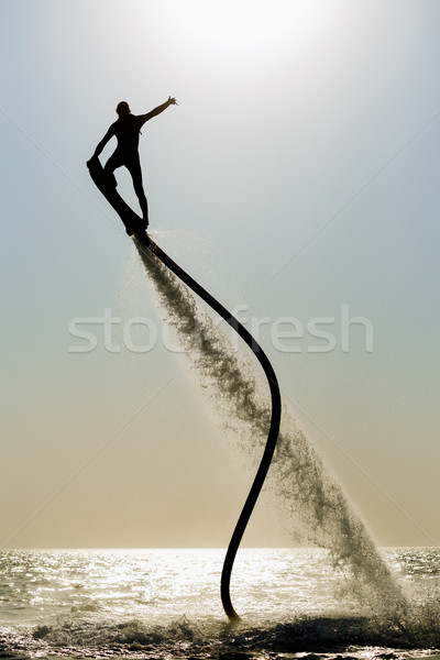 Sylwetka pokładzie plaży człowiek sportu skok Zdjęcia stock © mrakor