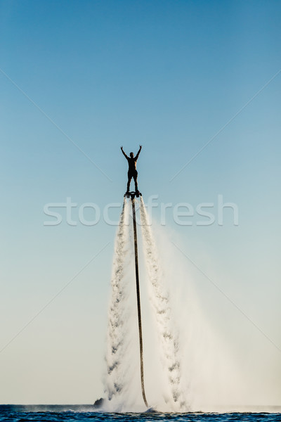 Zdjęcia stock: Sylwetka · latać · pokładzie · plaży · człowiek · sportu