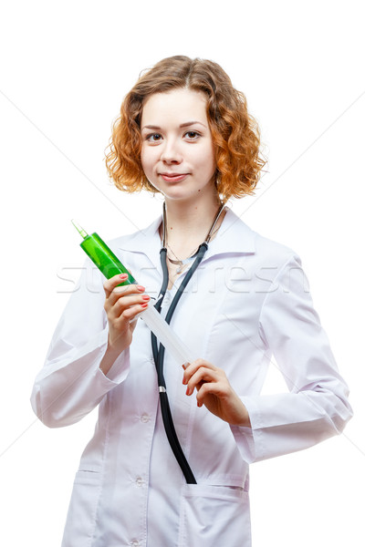 Aranyos vörös hajú nő orvos laborköpeny injekciós tű izolált Stock fotó © mrakor