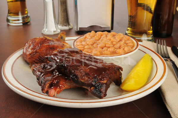Barbecued ribs and chicken with baked beans Stock photo © MSPhotographic