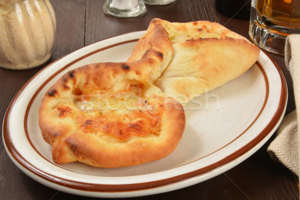 Folded pizza with beer Stock photo © MSPhotographic