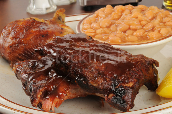 Barbecued ribs and chicken with baked beans Stock photo © MSPhotographic