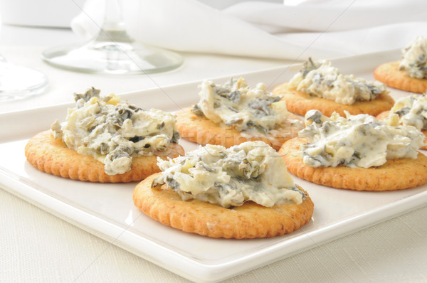 Crackers with spinach artichoke spread Stock photo © MSPhotographic