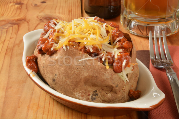 Baqked potato with chili and cheese Stock photo © MSPhotographic