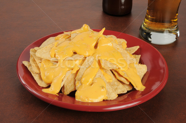 Tortilla chips with cheese sauce and beer Stock photo © MSPhotographic