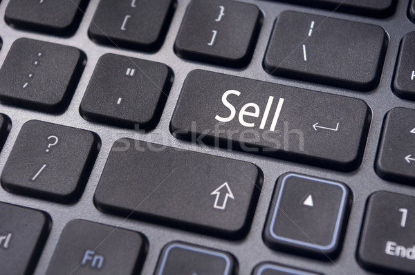 Vendere concetti mercato azionario messaggio tastiera qualcosa Foto d'archivio © mtkang