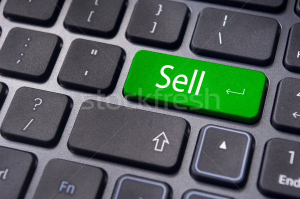 Vendere concetti mercato azionario messaggio tastiera qualcosa Foto d'archivio © mtkang