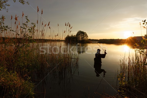 Pescatore lago acqua natura sunrise pesca Foto d'archivio © mtmmarek